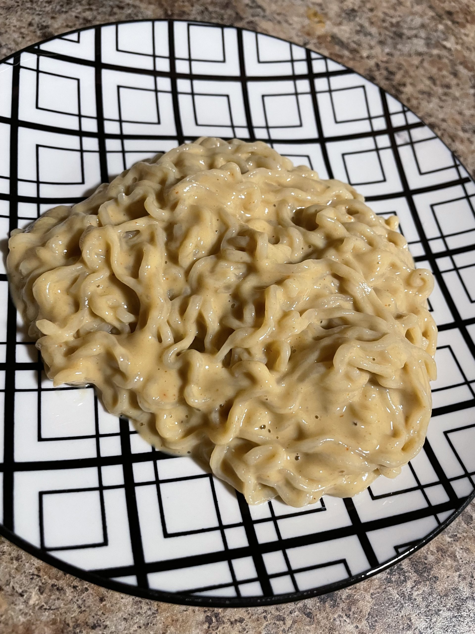 Peanut butter Ramen on a plate, toddler-friendly twist, avocado inspired meal idea.